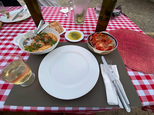 Dinner table set with Portuguese food. 