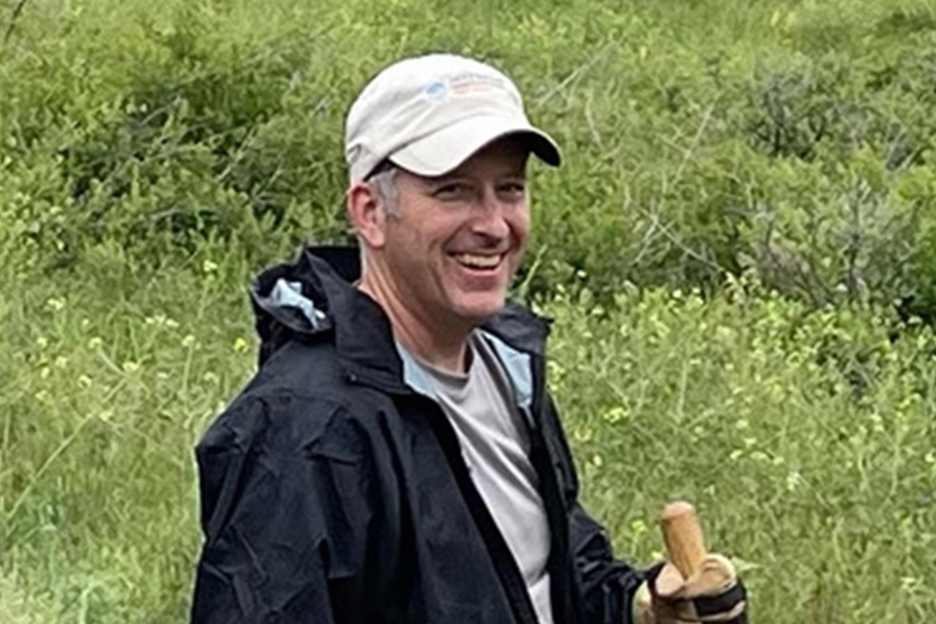 Oboz Local Hero, Dan Cavaliere, stands with a shovel on a recent trail work day.