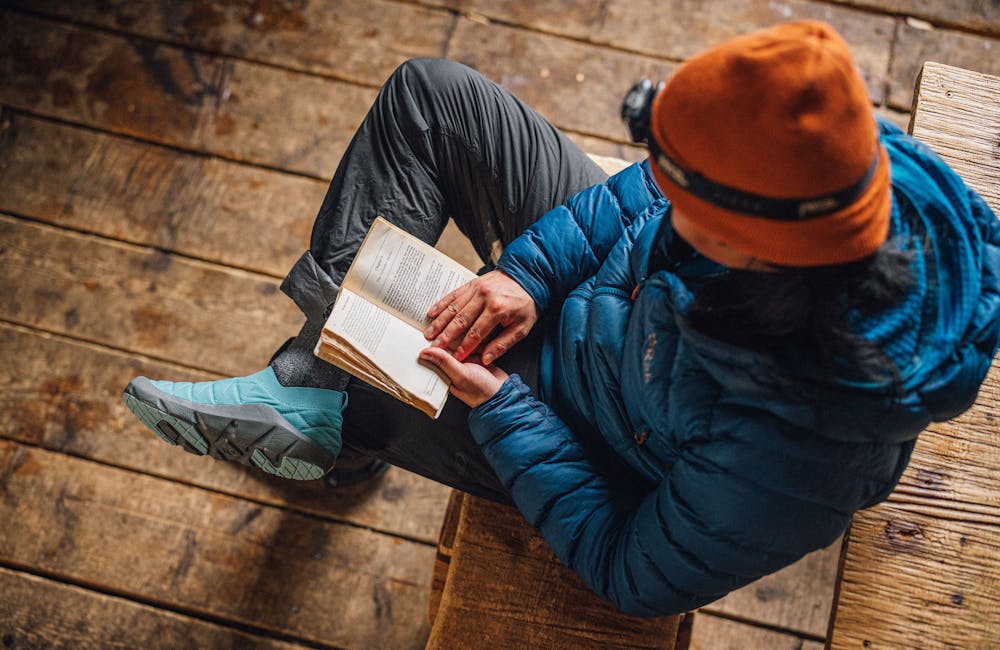 Reading a book in the Oboz Whakatā Low Print shoes.