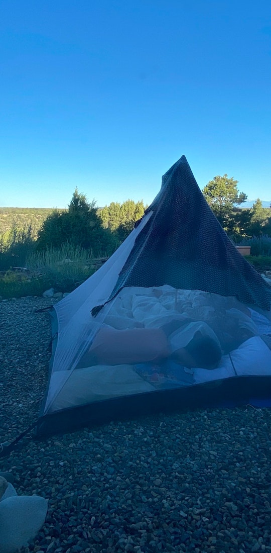 A tent set up in the wilderness