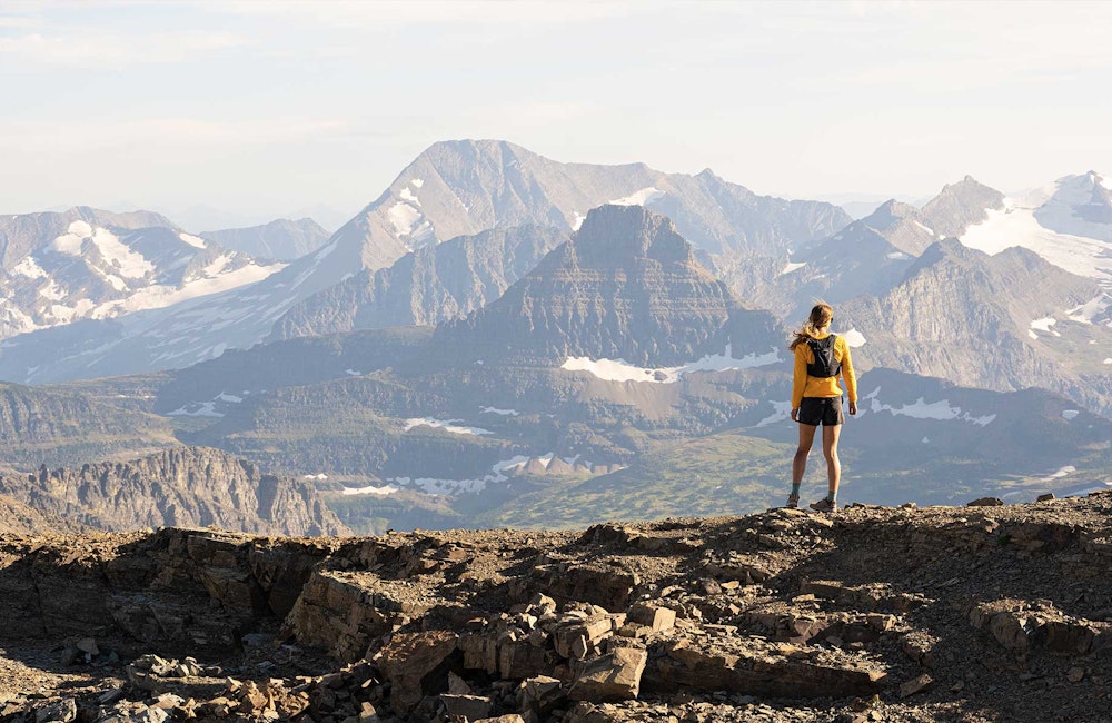 Woman backpacking in a gorgeous mountain landscape in Oboz Footwear.