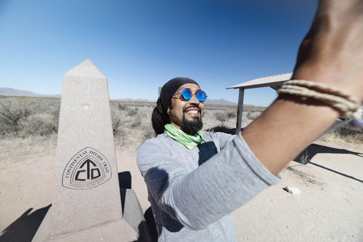 Oboz Athlete, Derick Lugo, at the southern terminus of the CDT.
