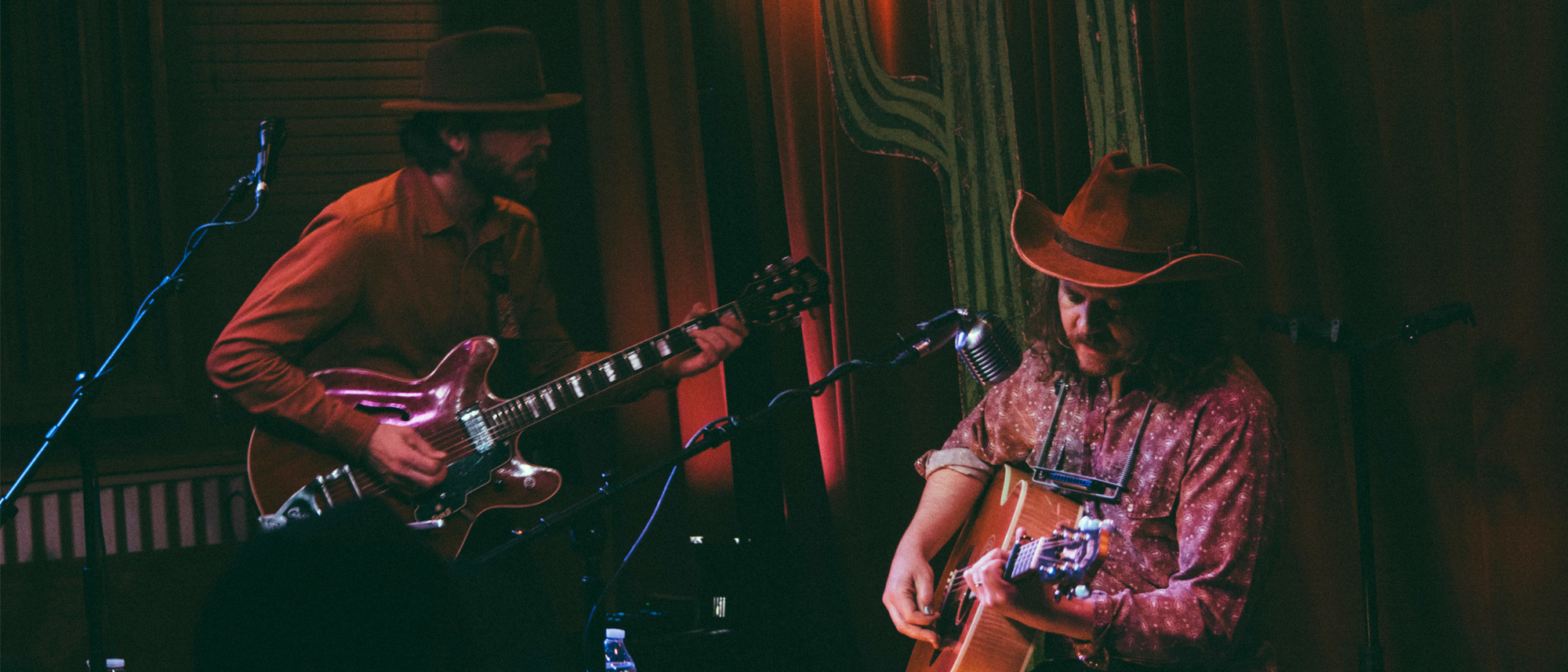 Two musicians performing at Live from the Divide in Bozeman, MT