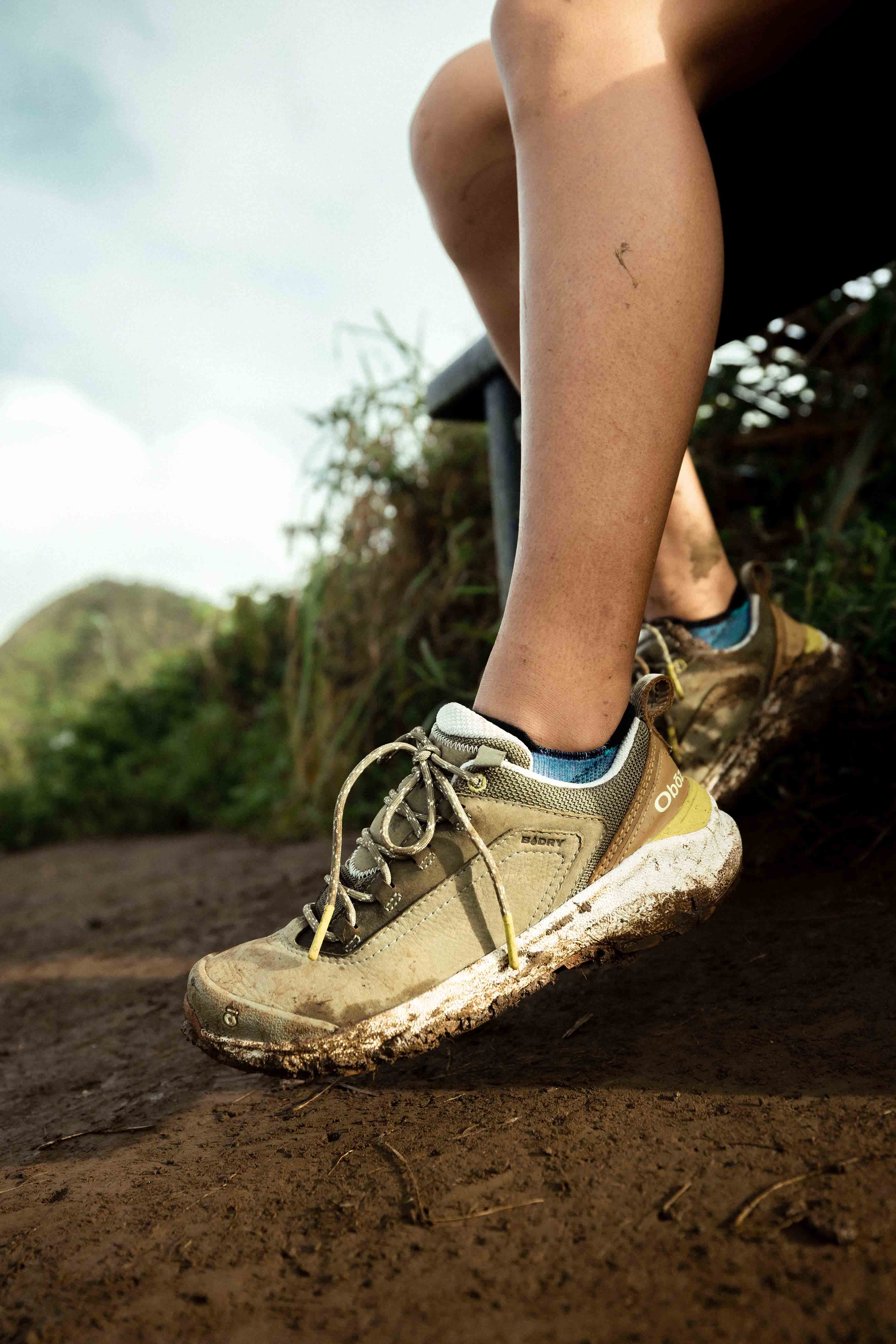 Woman wearing Oboz Cottonwood Low Waterproof hiking shoes on a sunny day.