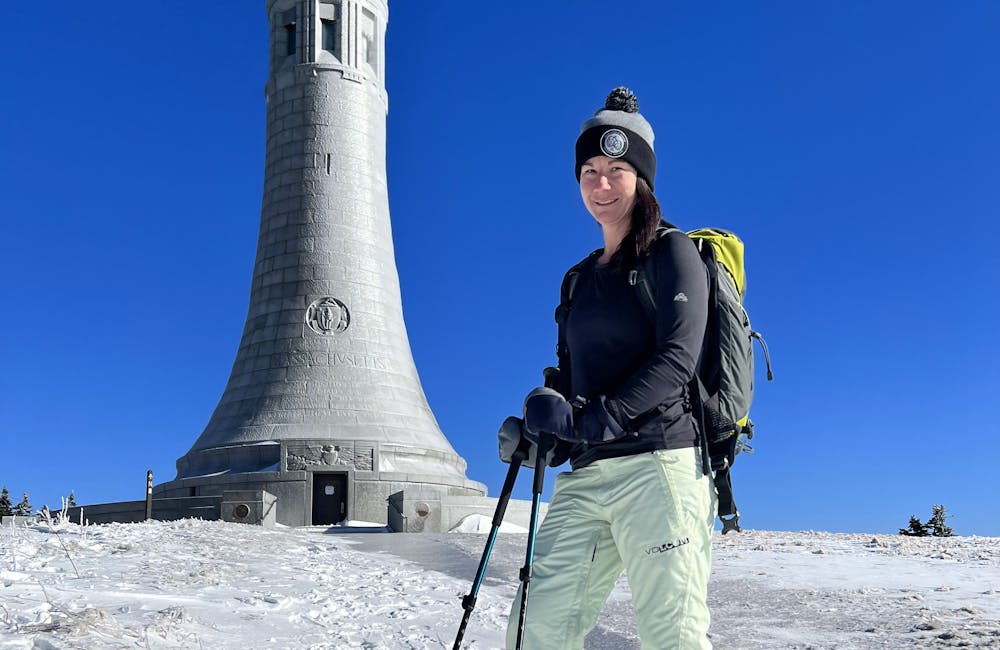 Oboz Footwear Lindsay Hill smiling while on a hike in the winter.