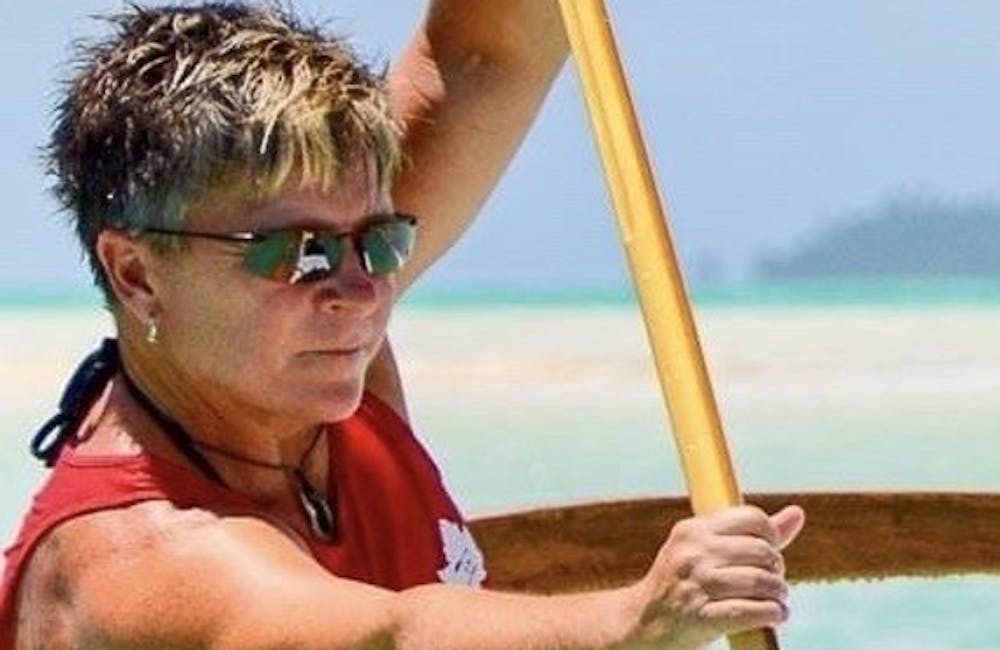 Oboz Footwear Trailblazer Kathleen Doherty paddling on a body of water.