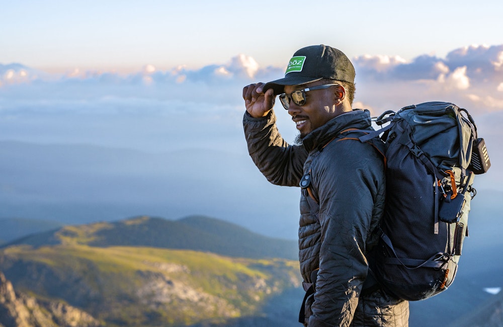 Oboz Footwear Trailblazer Evan Gill enjoying a beautiful view while hiking.