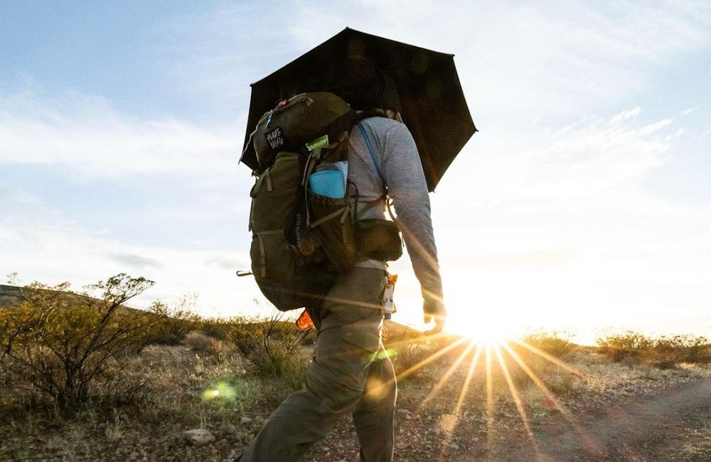 Derrick Lugo hiking the CDT in his Oboz Sawtooth X Mid hiking boots.
