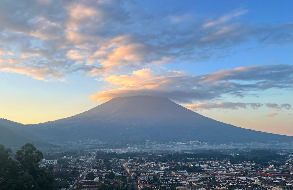 Beautiful view of glowing clouds above a volcano.