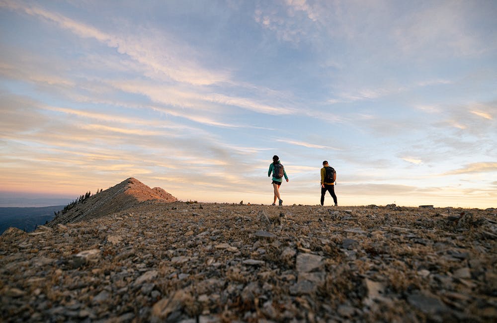 Two hikers on a mountain ridge walking in Oboz Katabatic hiking shoes