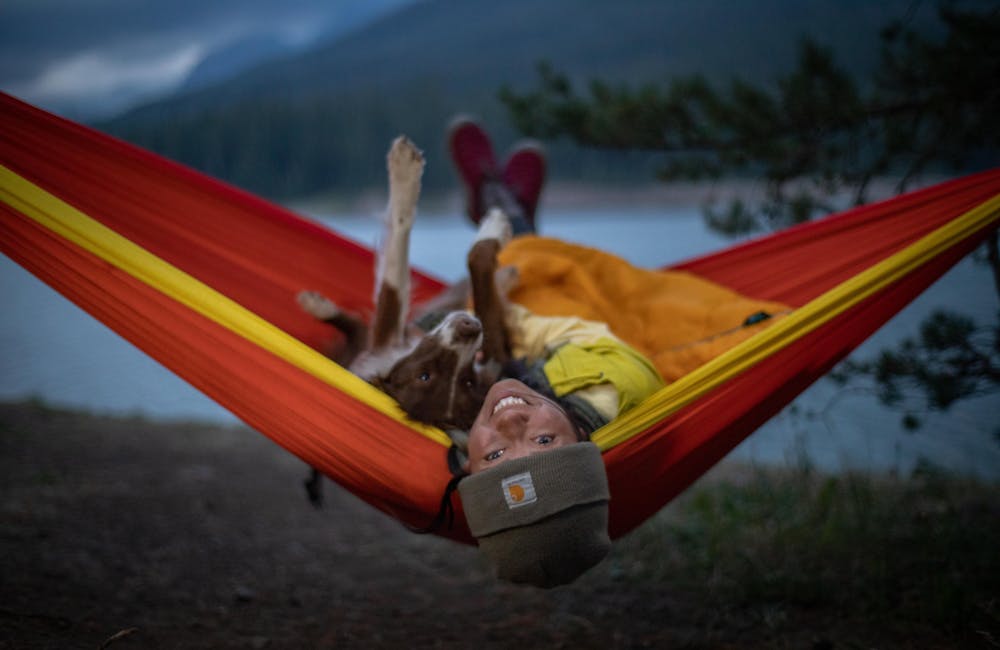 A woman relaxing in Oboz Whakata Puffy slippers.