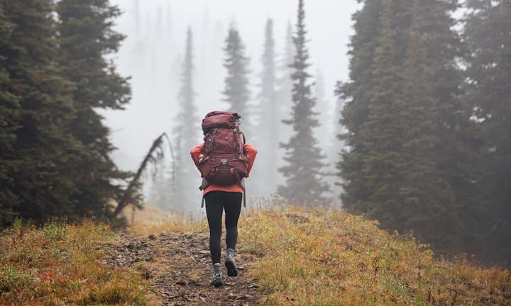 Women hiking on a rocky trail in Oboz Sawtooth X hiking boots.