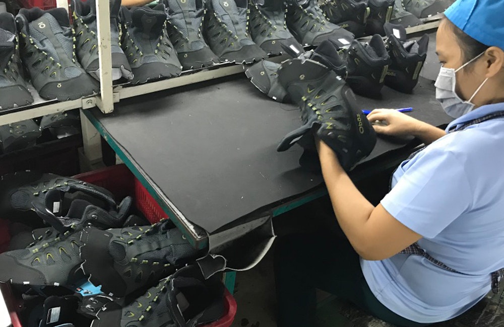 Oboz shoe employee constructing a shoe last in Vietnam.