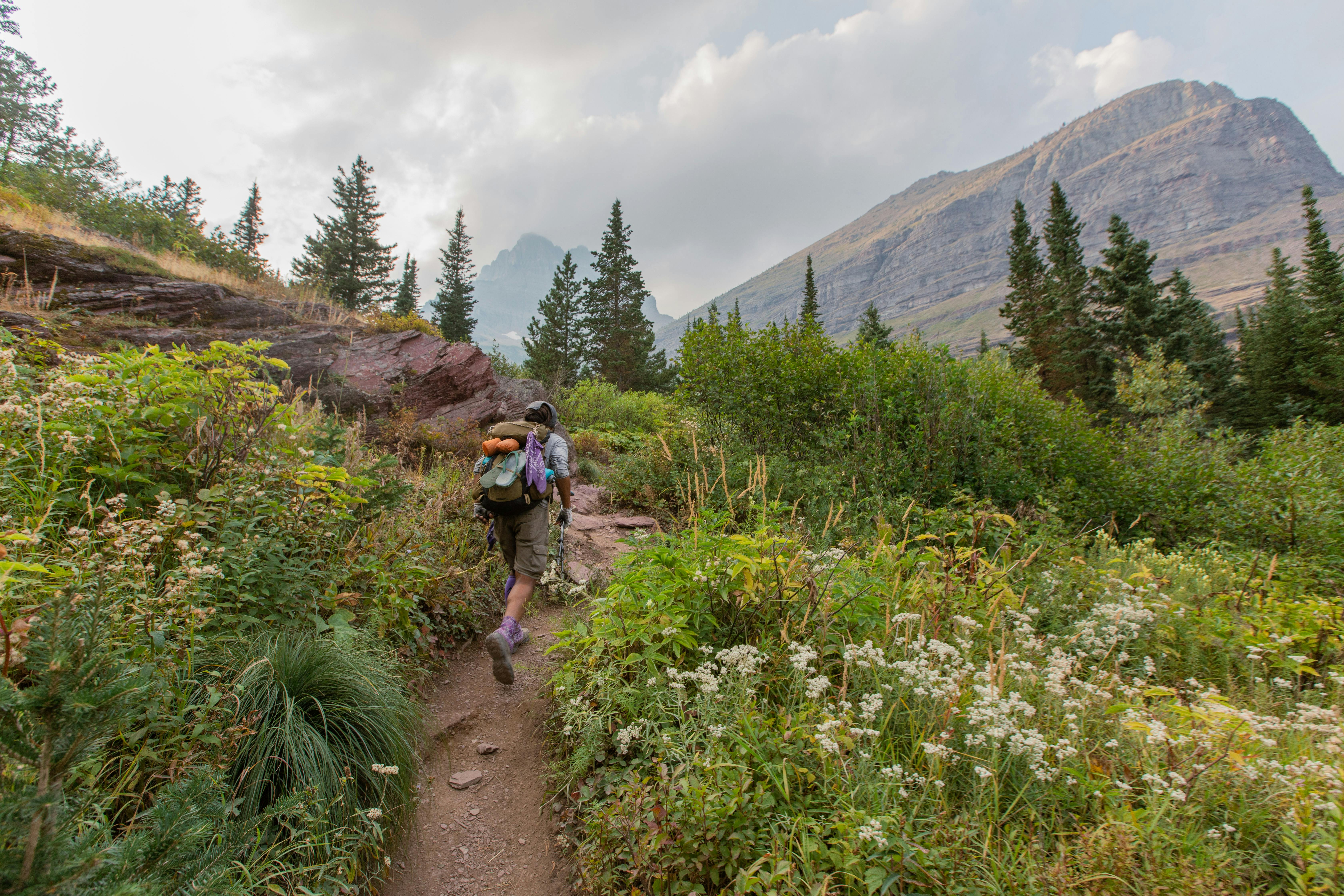 Derick Lugo thru hiking on a trail in beautiful mountains on the Continental Divide Trail