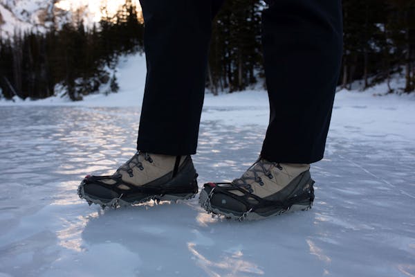 Oboz Ousel hiking shoes with microspikes for traction on icy surfaces during hikes.