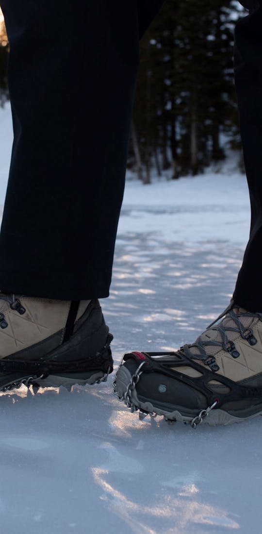 Oboz Ousel hiking shoes with microspikes for traction on icy surfaces during hikes.