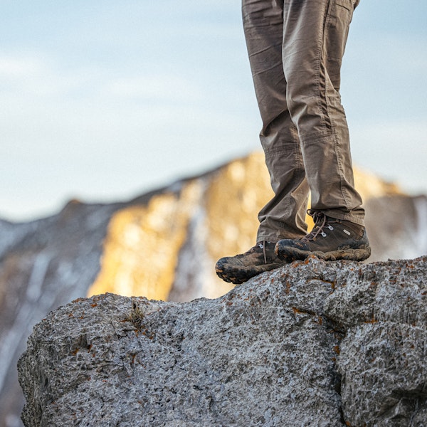 Oboz Men's Bridger Mid Waterproof on a rocky ledge.