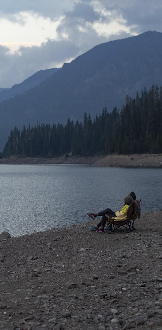 Two people enjoying the view at Hyalite lake near Bozeman, MT.