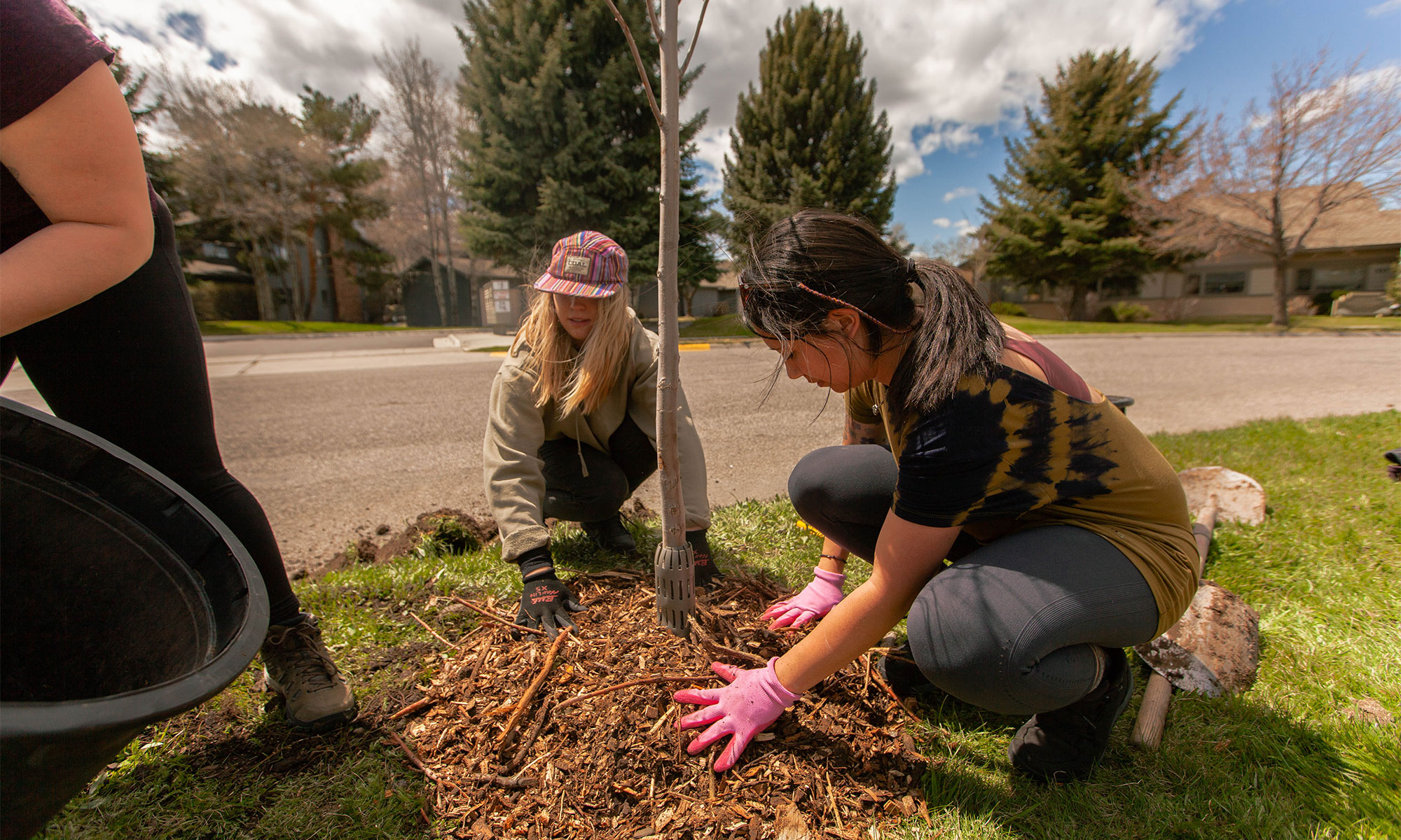 Two Oboz employees planting a tree.