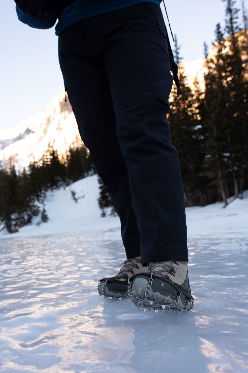 Kylie Yang in the Oboz Ousel waterproof footwear with microspikes for traction on an icy Colorado lake. 