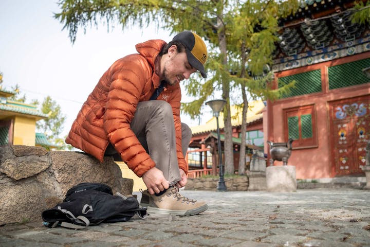 Man lacing up Oboz Beall Casual Shoe