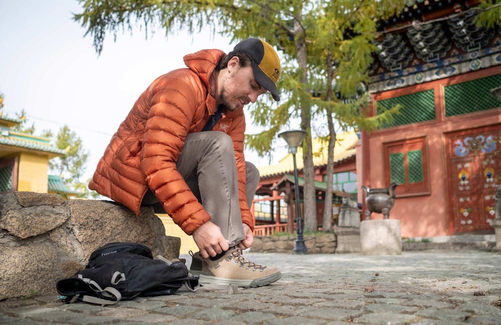 Man lacing up Oboz Beall Casual Shoe