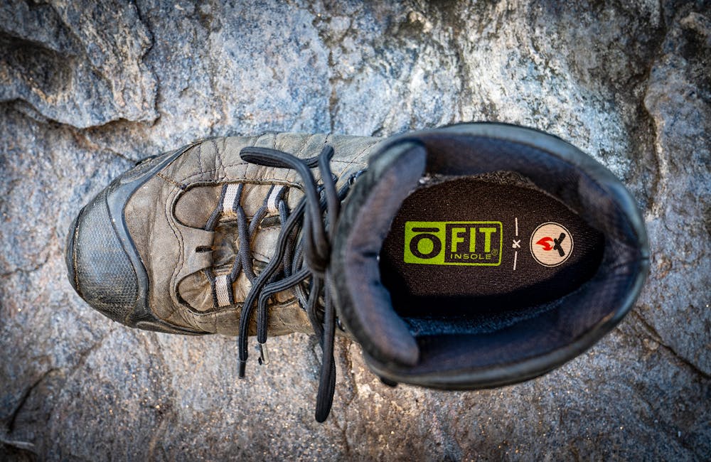 A Black Folks Camp Too insole in an Oboz Bridger Mid boot.