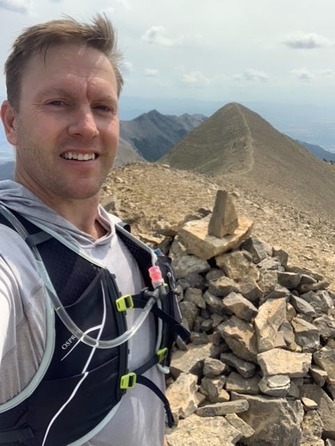 Jason Lessley summiting one of the 17 trail segments during the Oboz Trail Experience Bozeman on Sacajewea Peak.