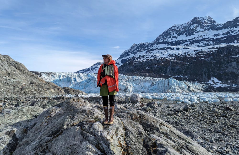 Oboz Trailblazer Ayla Mae Wild hiking in front of a glacier.