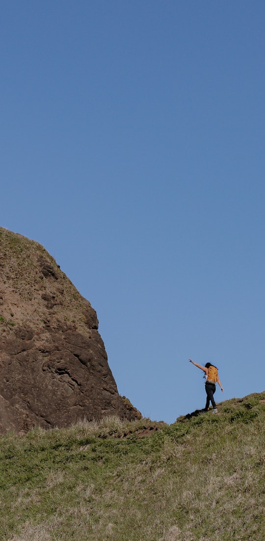 Lindsay Kagalis hiking the ridge of a mountain in the Women's Bozeman Mids shoes