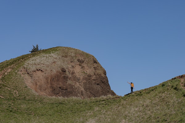 Lindsay Kagalis hiking the ridge of a mountain in the Women's Bozeman Mids shoes