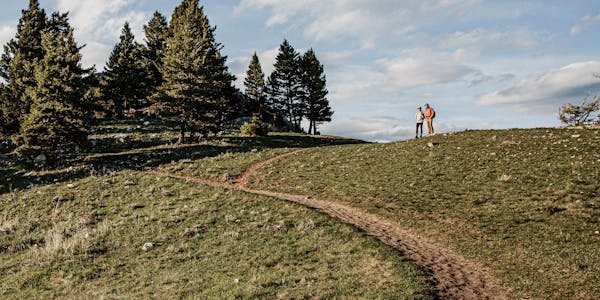 Two people hiking a trail near Bozeman, MT.