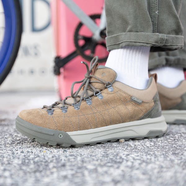 Closeup of the Oboz Beall Low casual shoe, in front of a bike.