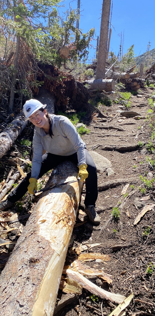 Woman doing trail maintenance in Oboz Sawtooth X Low hiking shoes. 