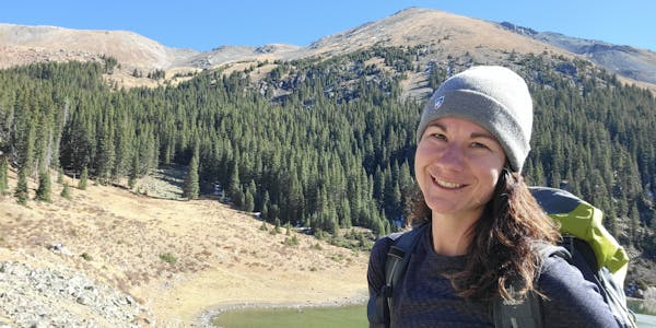 Oboz Footwear Lindsay Hill smiling while on a hike.