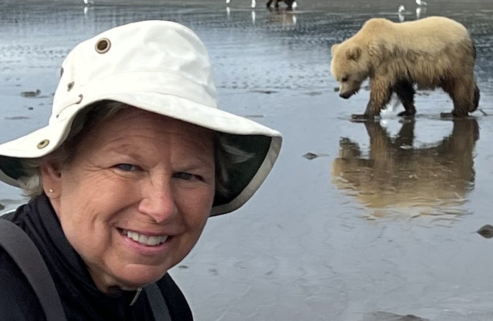 Oboz Footwear Trailblazer Jackie Seidman posing with a bear.