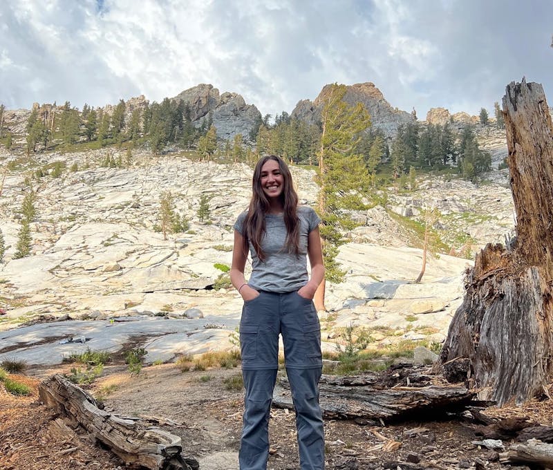 Oboz employee hiking on rocky mountain.