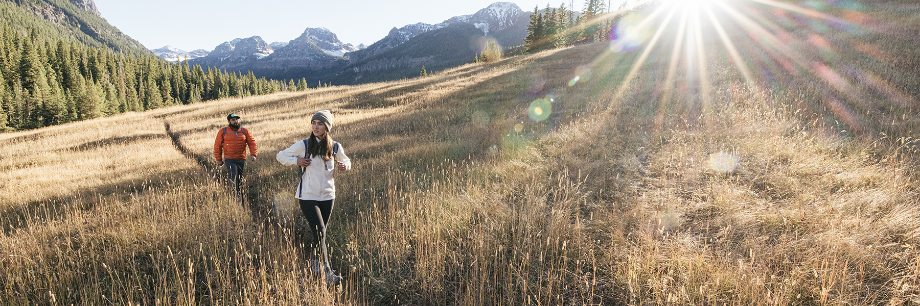 Two hiking partners enjoying an adventure in the mountains wearing Oboz hiking boots.