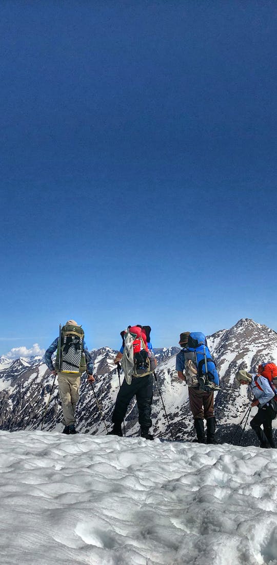 Backpacking on a snow covered trail in winter