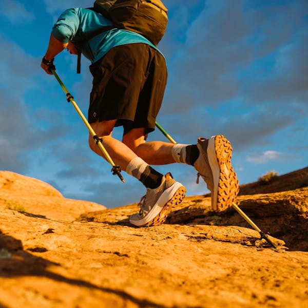 Two hikers moving quickly in the Oboz Katabatic LT Low hiking shoes.