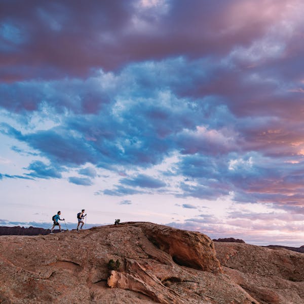 Hikers wearing Oboz Katabatic LT hiking shoes on a beautiful desert hiking trail.