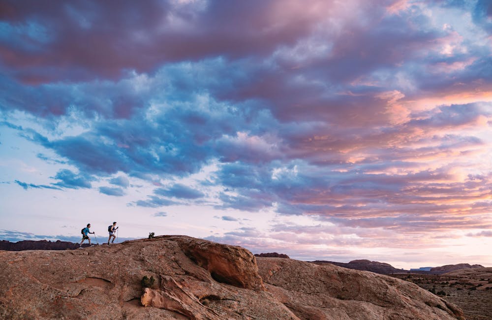 Hikers wearing Oboz Katabatic LT hiking shoes on a beautiful desert hiking trail.