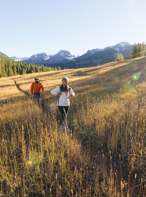 Hikers wearing Oboz Sawtooth II on a beautiful hiking trail.