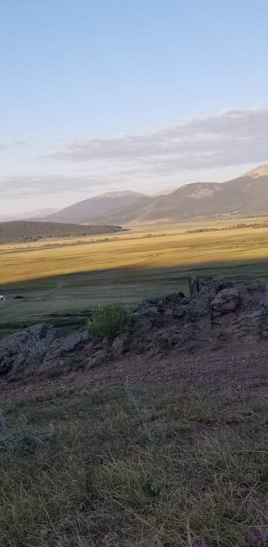 Tyler stands at an overlook during a backpacking adventure.