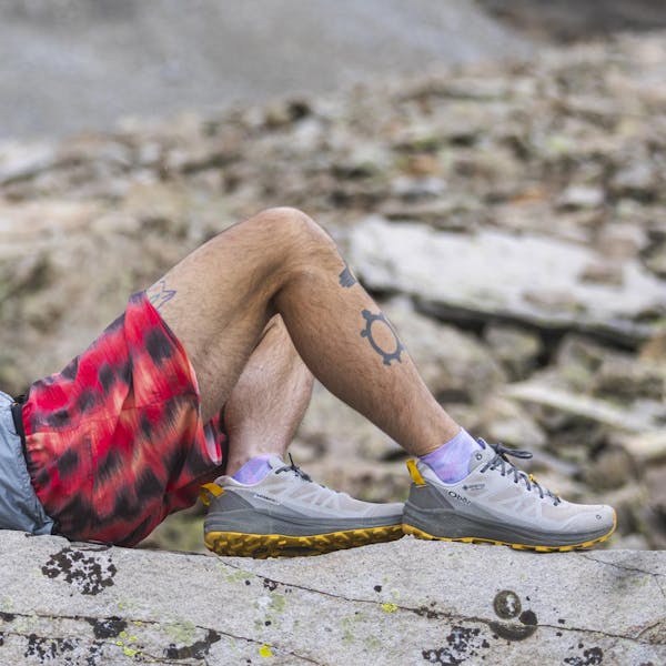 Relaxing during a hike while wearing Oboz Katabatic LT Gore-Tex hiking shoes.