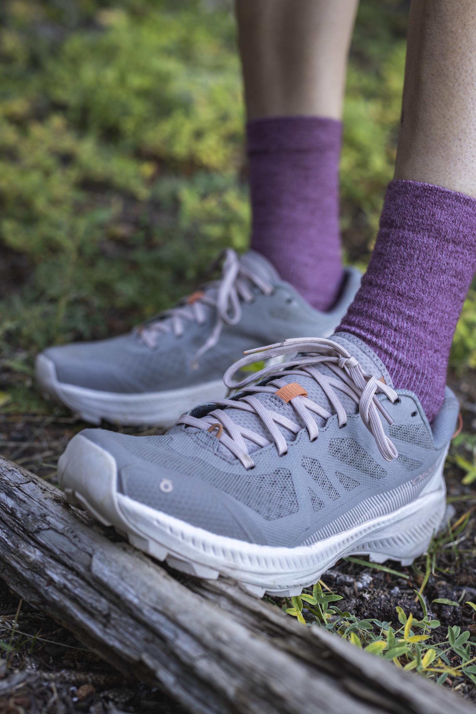 Pair of Oboz Katabatic LT Low hiking shoes on a forest trail.