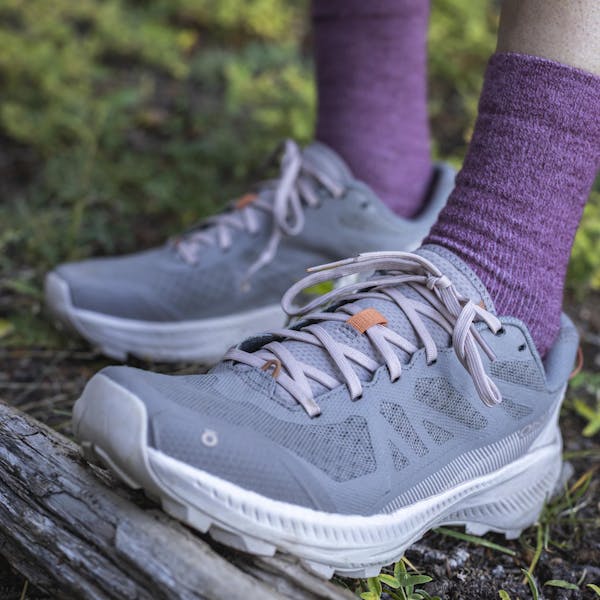 Pair of Oboz Katabatic LT Low hiking shoes on a forest trail.