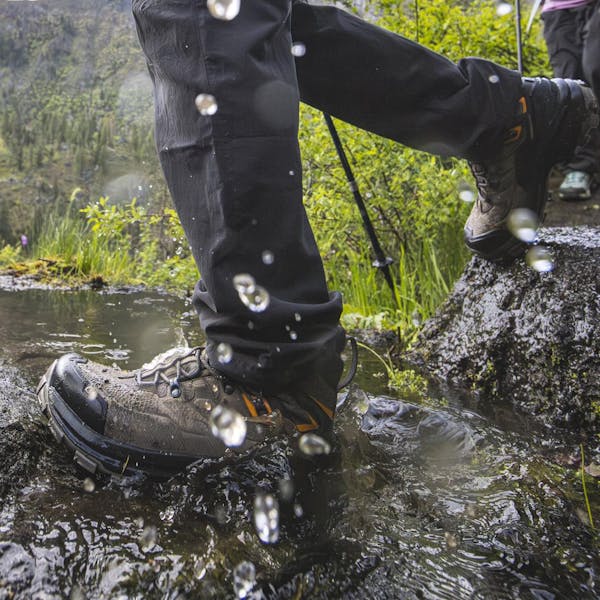 Wearing Oboz men's Bridger Peak Gore-Tex hiking boots through a creek crossing.