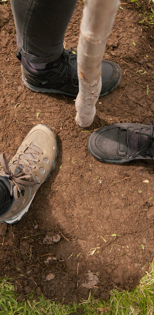 Oboz during a tree planting wearing Oboz hiking shoes.