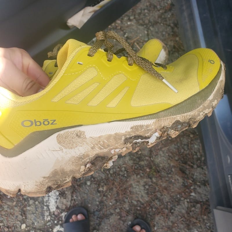 Oboz Katabatic fast trail shoe covered in mud after a long day of adventures.